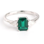 Royal Green Realm · 2 carat cultivated emerald Baquette shaped moissanite ring